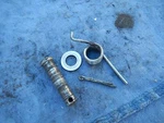 Left Hand Driver Foot Peg Mount Pivot Spring 1994 Suzuki GN125E. Fixed Price $8.80.